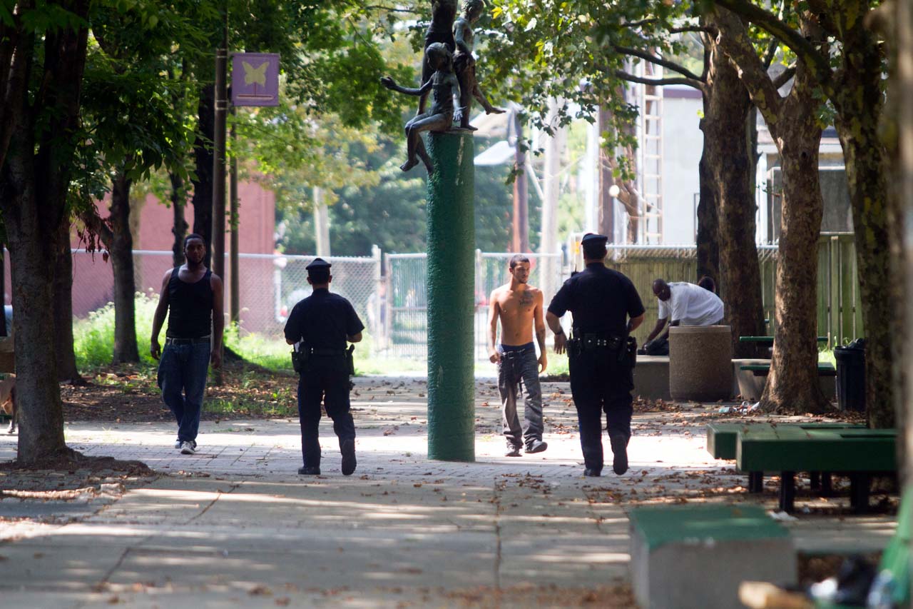 Two police officers and two young men
