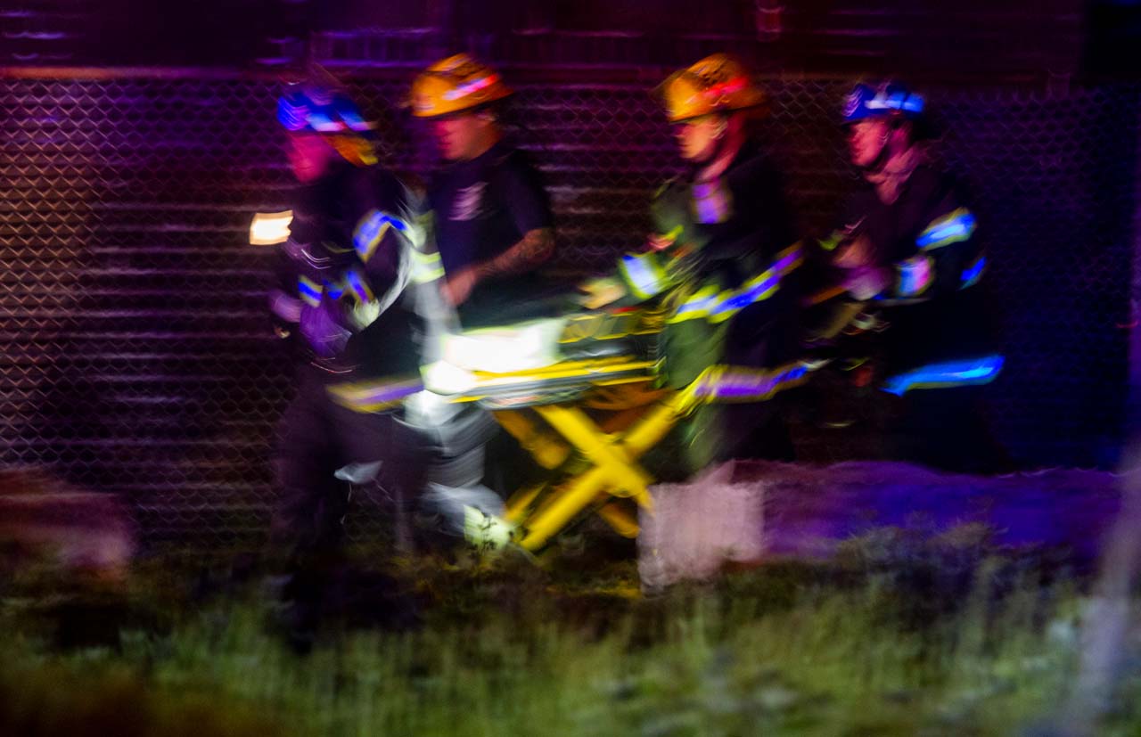 Medical personnel moving a stretcher
