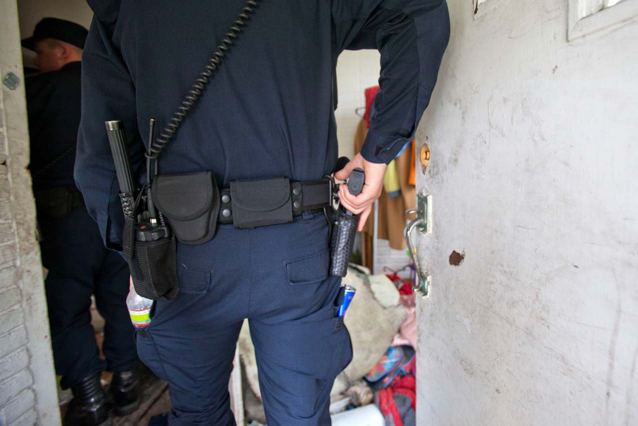 Police officer with hand on gun